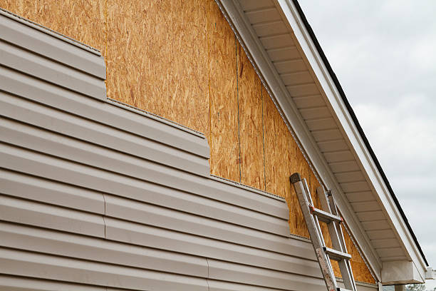 Professional Siding technician working in Loveville, MD